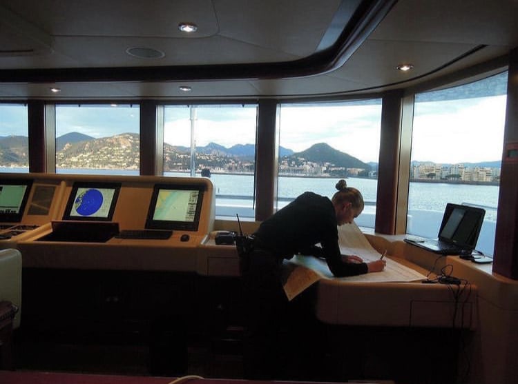 female captain on the bridge of a yacht